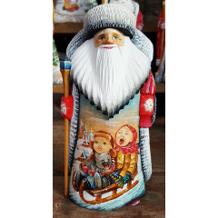 New Year and Christmas carved wooden toy Santa Claus, miniature children on a sled