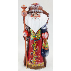 New Year and Christmas carved wooden toy Santa Claus with a straight stick in his hand